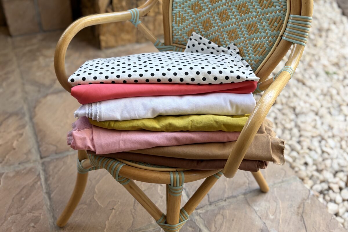 choosing fabric for a sewing project — fabric bolts and swatches