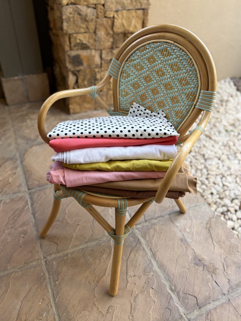 choosing fabric for a sewing project — fabric bolts and swatches